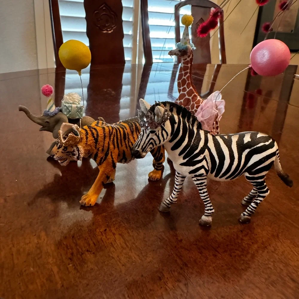 Zebra, tiger, elephant, and Giraffe Figurines